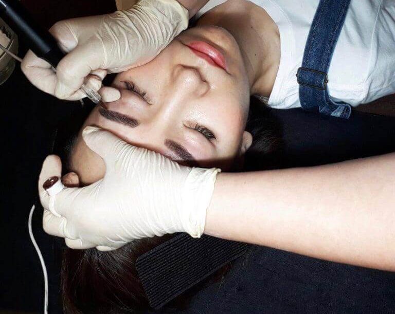 Person receiving medical makeover in beauty salon.