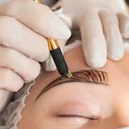 beautician-doing-microblading-procedure-client-s-eyebrows