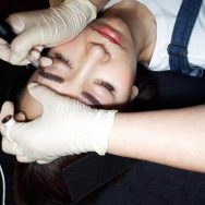 Person receiving medical makeover in beauty salon.